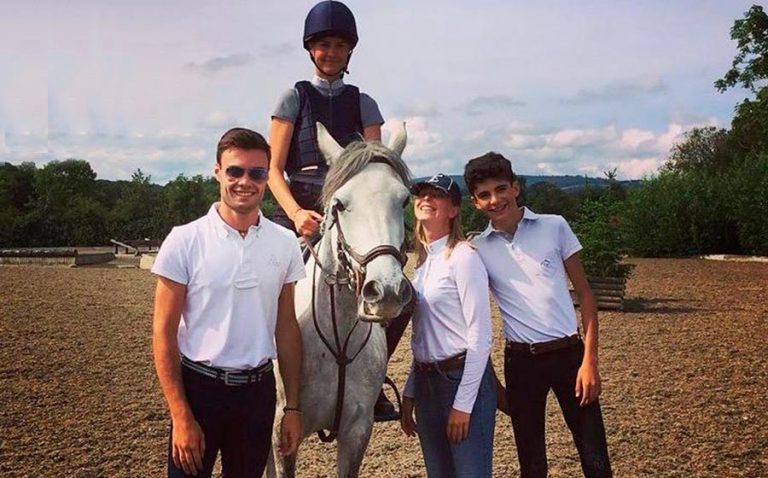 Teenager and instructors at Horseback Riding and English Camp Ireland.